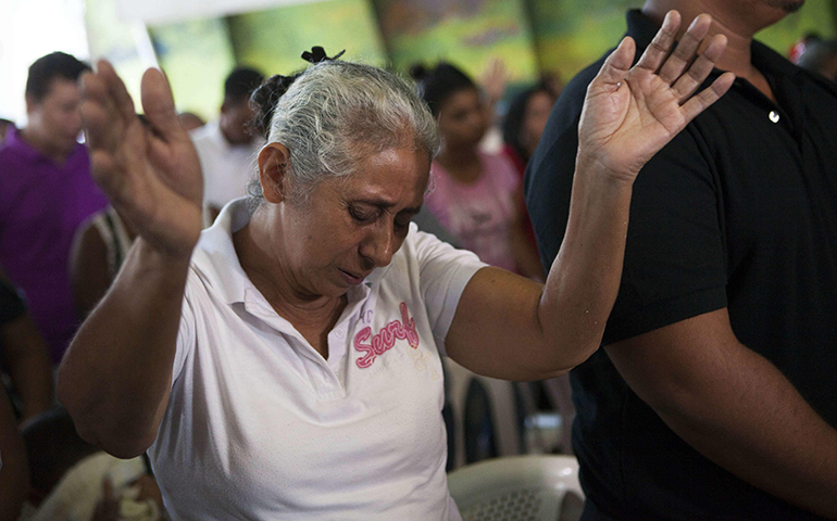 Lidia Tercero, whose son is on death row in Huntsville, Texas, prays during Mass in 2015 in Nicaragua, after her son, Bernardo, received a stay of execution. (CNS/Mario Lopez, EPA)