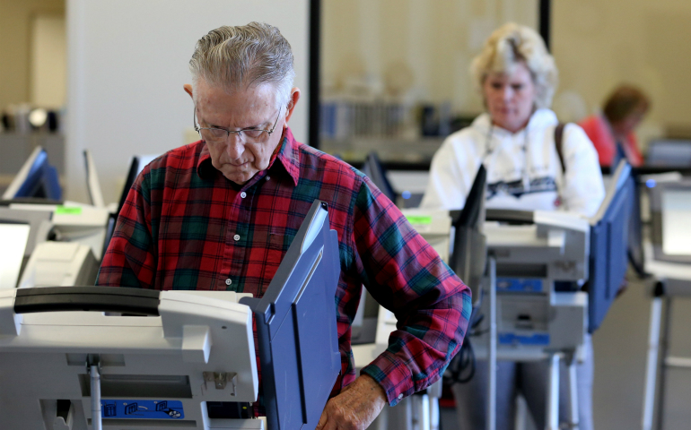 Voters cast ballots in Cleveland as early absentee voting began Oct. 12 ahead of the Nov. 8 U.S. presidential election. (CNS photo/Aaron Josefczyk, Reuters)