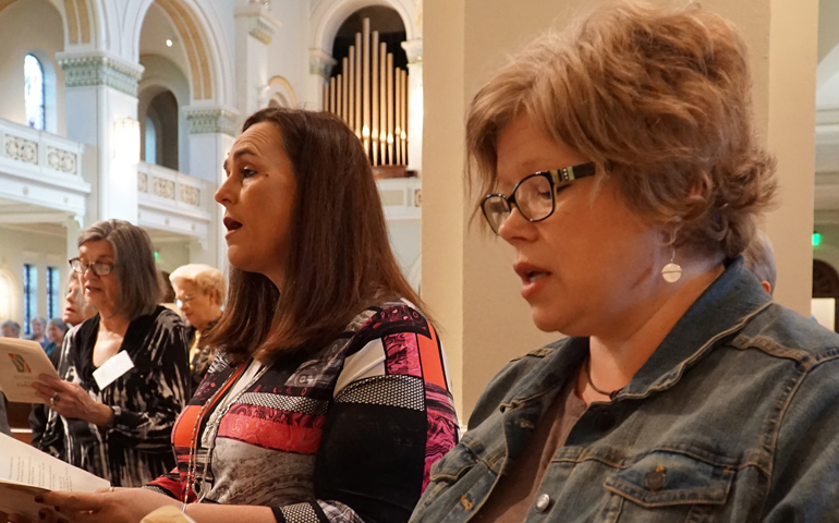 Jonna O'Bryan, foreground, and Carrie Williamson of St. Patrick Church in Louisville, Ky., sing Oct. 9 during the closing liturgy of the "Women of the Church" conference in Ferdinand, Ind. (CNS/Marnie McAllister, The Record)