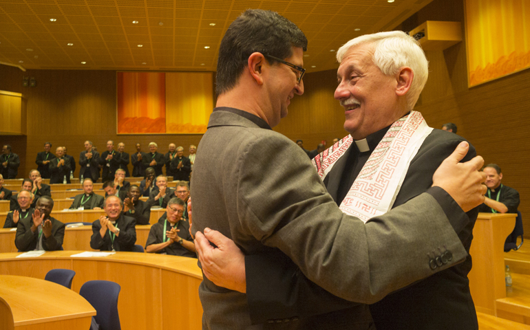 Jesuit Fr. Arturo Sosa, right, greets Jesuit Fr. Arturo Ernesto, after Sosa was elected as superior general in Rome Oct. 14. (CNS/Don Doll, S.J.)