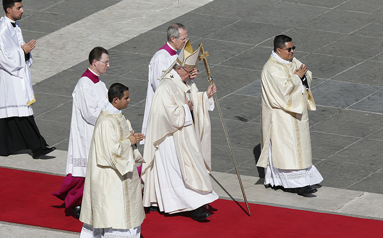 Pope Francis walks to the altar at the canonization Mass for seven new saints in St. Peter's Square at the Vatican Oct. 16. (CNS/Paul Haring)