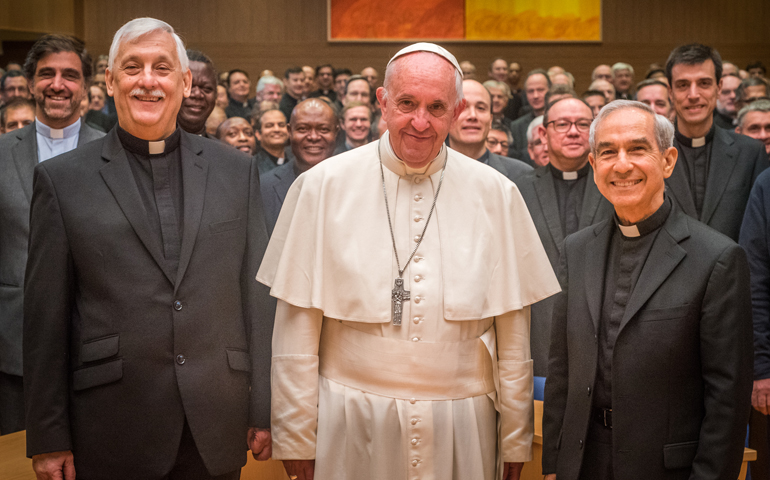 Fr. Arturo Sosa Abascal, Pope Francis, Fr. Orlando Torres, and other delegates pose for a photo in Rome Oct. 24.