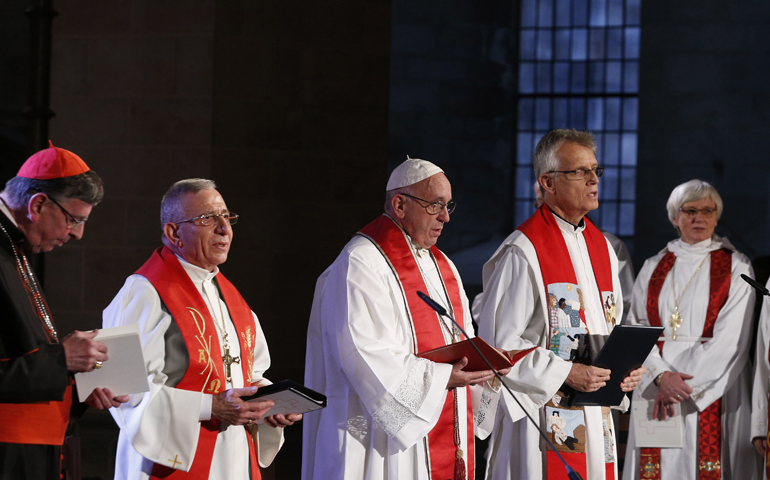 Pope Francis, Rev. Martin Junge, and Archbishop Antje Jackelen, far right, attend an ecumenical prayer service Oct. 31 at the Lutheran cathedral in Lund, Sweden. At far left, Cardinal Kurt Koch. (CNS/Paul Haring)