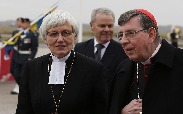 Archbishop Antje Jackelen, primate of the Lutheran church in Sweden, and Cardinal Kurt Koch, president of the Pontifical Council for Promoting Christian Unity, are seen as Pope Francis arrives Oct. 31 in Malmo, Sweden. (CNS/Paul Haring)
