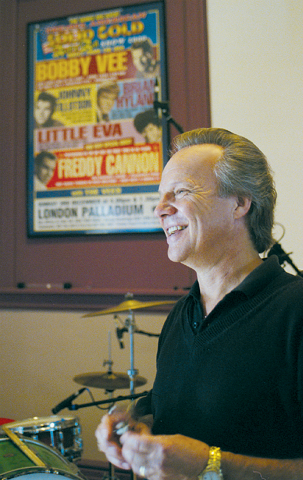 Music legend Bobby Vee smiles during a 2002 interview at his studio in St. Joseph, Minn. The Catholic pioneer of rock 'n' roll, born Robert Thomas Velline, died Oct. 24 at age 73 after battling Alzheimer's disease. (CNS photo/Dianne Towalski, The Visitor)