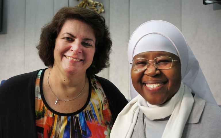 Ivonne van de Kar, an anti-trafficking advocate from the Netherlands, is seen at the Vatican press hall with Sister Monica Chikwe, a member of the Hospitaler Sisters of Mercy, who works with trafficked Nigerian women, Nov. 4. They are both members of the RENATE network of religious congregations in Europe fighting human trafficking. (CNS photo/Carol Glatz)