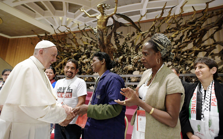 Pope Francis greets attendees during a Nov. 5 meeting at the Vatican with participants in the third World Meeting of Popular Movements. (CNS/EPA/L'Osservatore Romano)
