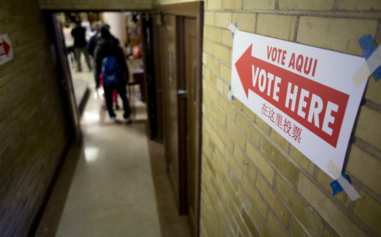 Voters enter the the John Bailey Room at St. Francis Xavier Church in Washington Nov. 8. (CNS photo/Tyler Orsburn)