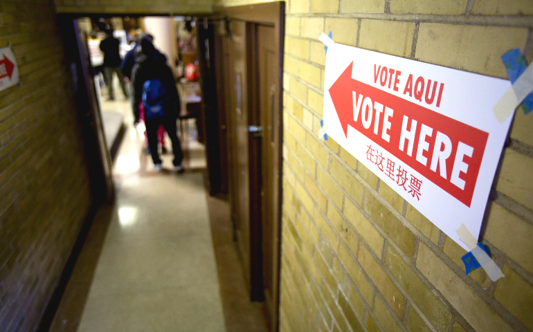 Voters enter the John Bailey Room at St. Francis Xavier Church in Washington Nov. 8. (CNS/Tyler Orsburn)