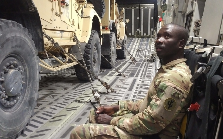 Fr. Charles Awotwi, a priest of the Salina, Kan., diocese is seen aboard a C-17 transport with the U.S. Army in this undated photo. (CNS/courtesy The Register)