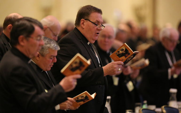 Cardinal-designate Joseph W. Tobin of Indianapolis, center, joins other bishops during morning prayer Nov. 15 at the annual fall general assembly of the U.S. Conference of Catholic Bishops in Baltimore. (CNS/Bob Roller)