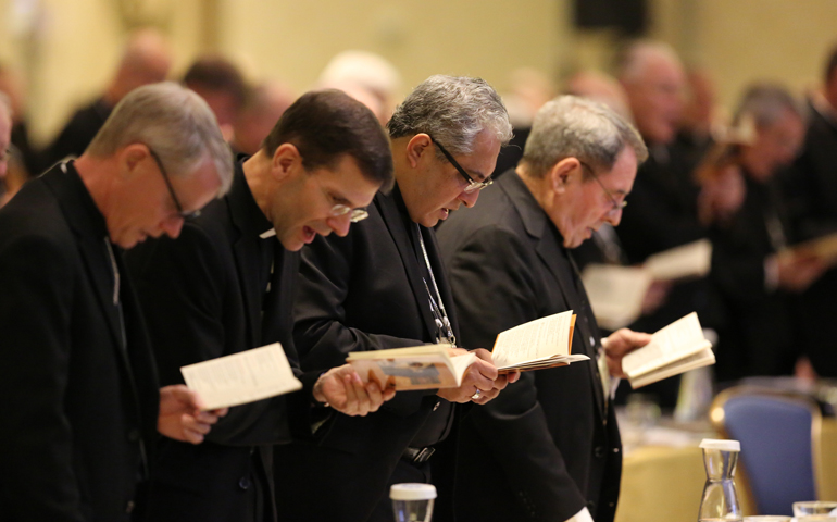 Bishops bow during morning prayer Nov. 15 at the annual fall general assembly of the U.S. Conference of Catholic Bishops in Baltimore. (CNS/Bob Roller)