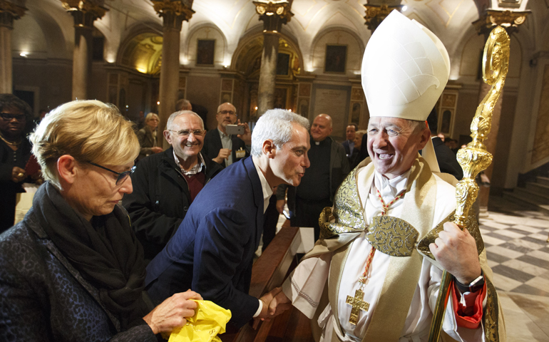 New Cardinal Blase Cupich greets Chicago Mayor Rahm Emanuel after a prayer service at which he took possession of his titular church of St. Bartholomew on Tiber Island in Rome Nov. 20. (CNS/Paul Haring)