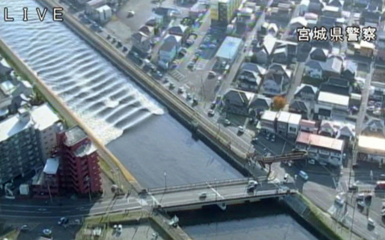 A tidal surge is seen in this video grab of Sunaoshi River after tsunami advisories were issued following an earthquake in Tagajo, Japan, Nov. 22. (CNS/ Miyagi Prefectural Police via Reuters) 