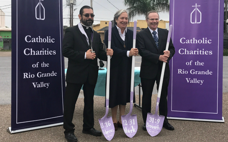 Bishop Daniel E. Flores of Brownsville, Texas, Sister Norma Pimentel, a member of the Missionaries of Jesus who is executive director of Catholic Charities of the Rio Grande Valley, and McAllen Mayor Jim Darling pose for a photo during the Dec. 1 groundbreaking ceremony for the diocese's new Humanitarian Respite Center. (CNS photo/courtesy Catholic Charities)