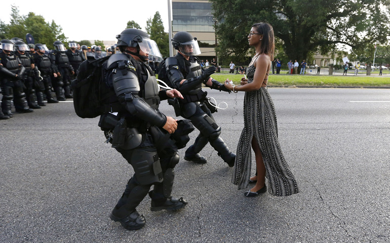 Ieshia Evans is detained in early July by law enforcement as she protests the fatal shooting of a black man by police near the headquarters of the Baton Rouge Police Department in Louisiana. (CNS/Reuters/Jonathan Bachman)