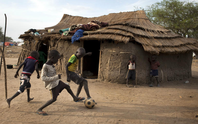 Children play soccer in 2014 at a camp for displaced people in Minkamman, South Sudan. Pax Christi International, the Catholic peace movement, said it will build up young people to contribute to peace and justice in Africa, noting that children are the continent's greatest resource. (CNS photo/Jim Lopez, EPA)