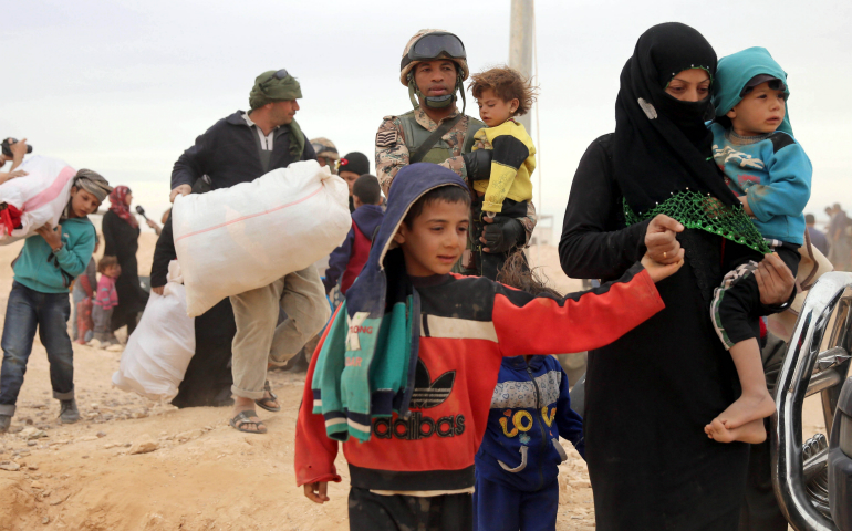 Syrian refugees arrive in early May at a camp on the border in Royashed, Jordan. (CNS photo/Jamal Nasrallah, EPA)