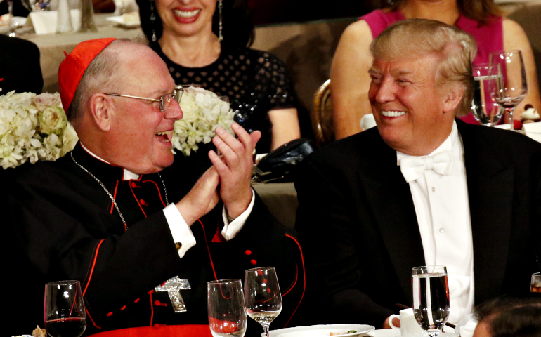 Donald Trump smiles as he sits next to New York Cardinal Timothy Dolan during the Alfred E. Smith Memorial Foundation Dinner in New York City Oct. 20. (CNS/Gregory A. Shemitz)