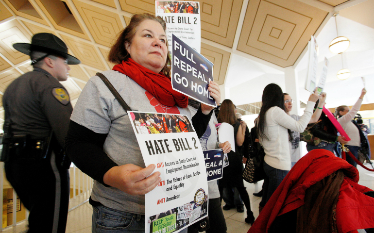 : Opponents of North Carolina's law limiting bathroom access for transgender people protest above the state's House of Representatives chamber in Raleigh, N.C., Dec. 21. (CNS photo/Jonathan Drake, Reuters)