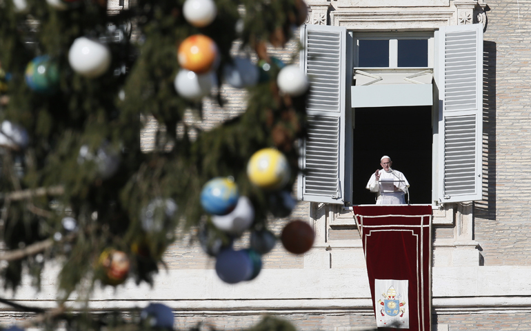 Pope Francis leads the Angelus from his studio overlooking St. Peter's Square  Jan. 6 at the Vatican, the feast of the Epiphany. (CNS/Paul Haring)