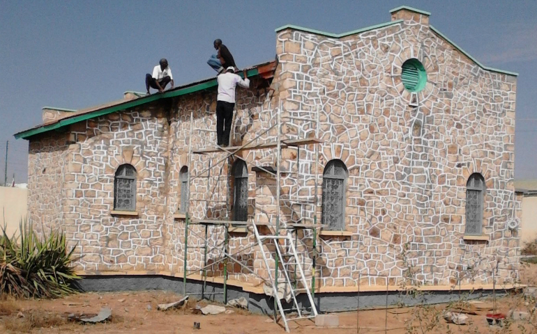 : Men are seen working on a church in 2016 in Hargeisa, Somalia. The church has been rebuilt and serves a Catholic community of 10-15 people. (CNS photo/courtesy Father Tom Donovan)