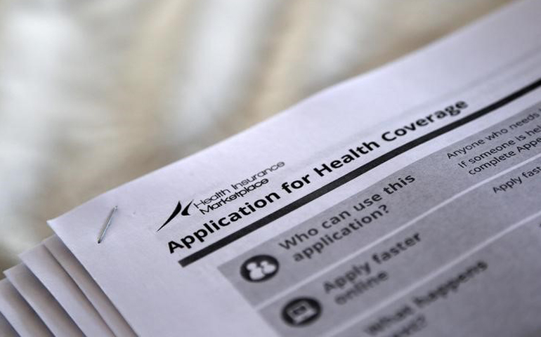 The federal government forms for applying for health coverage are seen in this 2013 photo. (CNS/Reuters/Jonathan Bachman)