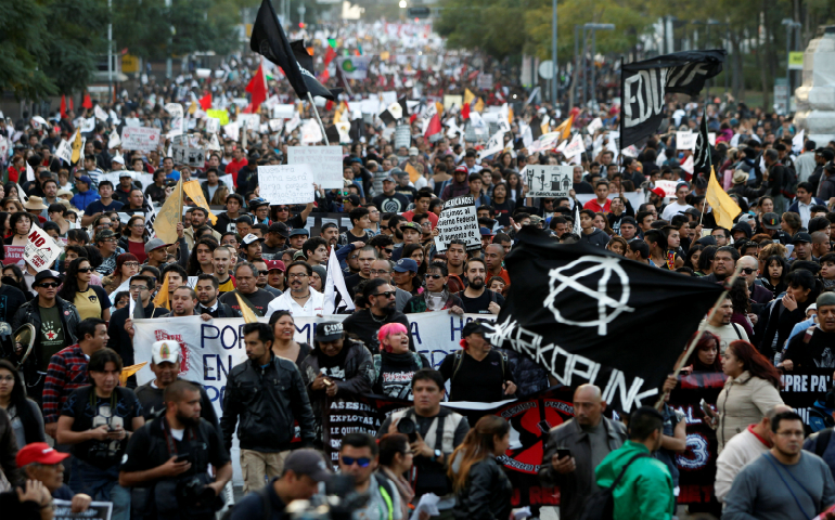Demonstrators take part in a Jan. 9 protest against a fuel price hike in Mexico City. (CNS photo/Carlos Jasso, Reuters)