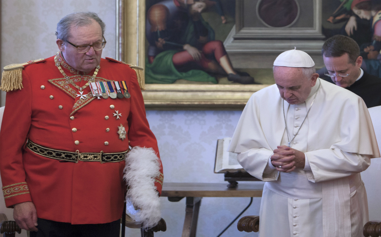 Pope Francis is pictured with Fra Matthew Festing, former grand master of the Sovereign Military Order of Malta, during a private audience with members of the order at the Vatican in this June 23, 2016, file photo. Festing  accepted Pope Francis' request that he resign following weeks of tensions with the Vatican over the dismissal of the order's former chancellor, Albrecht Freiherr von Boeselager. (CNS photo/Maria Grazia Picciarella, pool)