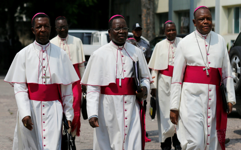 Congolese Bishop Fidele Nsielele Zi Mputu, Archbishop Marcel Utembi Tapa and Bishop Fridolin Ambongo Besungu arrive in December 2016 to mediate talks between the opposition and the government of President Joseph Kabila in Kinshasa. Congo's bishops are urgently seeking to rescue a government-opposition peace accord, reached in the final minutes of 2016. (CNS photo/Thomas Mukoya, Reuters)