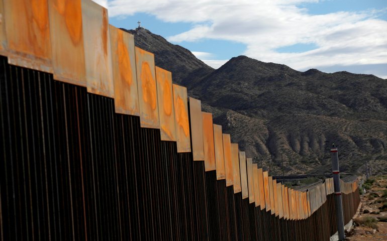 A photo taken in 2016 shows a newly built section of the U.S.-Mexico border wall at Sunland Park, N.M., opposite the Mexican border city of Ciudad Juarez, Mexico. President Donald Trump enacted two executive memorandums to deal with security, including one that calls for construction of a wall along the U.S.-Mexico border. (CNS photo/Jose Luis Gonzalez, Reuters)