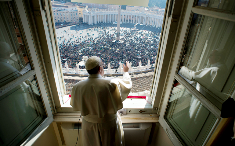 Pope Francis greets the crowd as he leads the Angelus from his studio overlooking St. Peter's Square at the Vatican Jan. 29. (CNS/L'Osservatore Romano, handout)