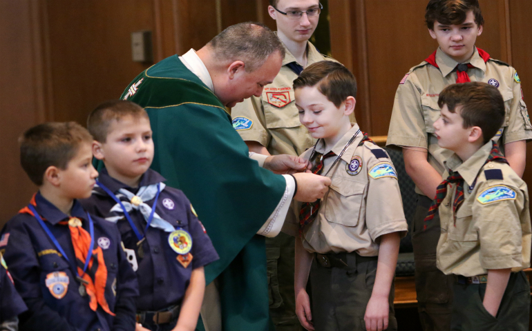 Cub Scouts prepare to participate in the presentation of the gifts during a Mass marking Scout Sunday at St. Joseph Church in Kings Park, N.Y., Feb. 5. Scout Sunday is celebrated annually by the Boy Scouts of America to recognize the contributions of young people and adults to Scouting. (CNS photo/Gregory A. Shemitz)