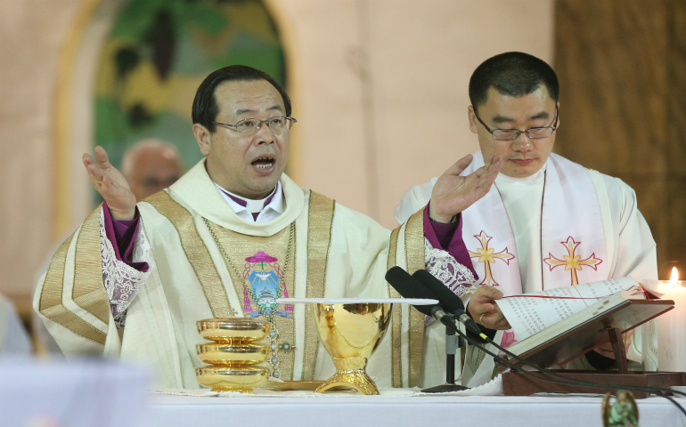 Archbishop Joseph Li Shan of Beijing celebrates Christmas Eve Mass in 2016 at the Cathedral of the Immaculate Conception. China and the Vatican have reached consensus on the appointment of bishops, which will lead to the resolution of other outstanding problems, said Hong Kong Cardinal John Tong. (CNS photo/Wu Hong, EPA)
