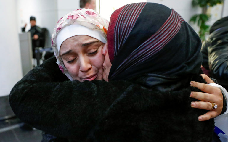 Syrian refugee Baraa Haj Khalaf is greeted by her mother, Fattoum Haj Khalaf, after arriving Feb. 7 at O'Hare International Airport in Chicago. (CNS/Kamil Krzaczynski, Reuters)