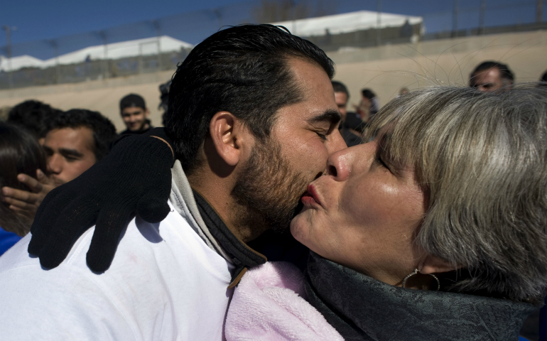 Graciela Roque kisses her son, Efrain Rodriguez, who she has not seen in nine years, during a massive reunion called "Abrazos, No Muros" (Hugs, Not Walls) Jan. 28. Canadian refugee advocates expect to see a slight increase in border crossings from the U.S. as it toughens its immigration enforcement. (CNS photo/David Maung)