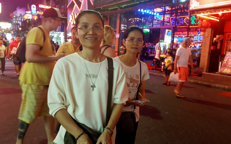 Sr. Piyachat Boonmul (left) and Sr. Apinya Sornjan (right) go out on the streets of the bar scene in Pattaya, Thailand, a few times a month. (GSR photo / Gail DeGeorge)