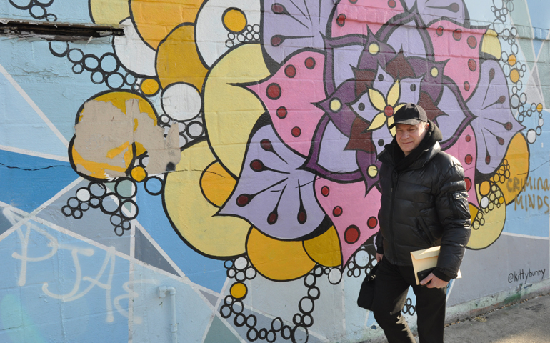 Father Frank Mann views some of the street art Feb. 8 in the Bushwick section of Brooklyn, N.Y. (CNS /Ed Wilkinson, The Tablet)
