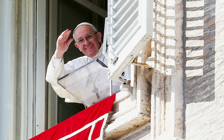 Pope Francis waves as he leads the Angelus from his studio overlooking St. Peter's Square Feb. 26 at the Vatican. (CNS/Reuters/Alessandro Bianchi)