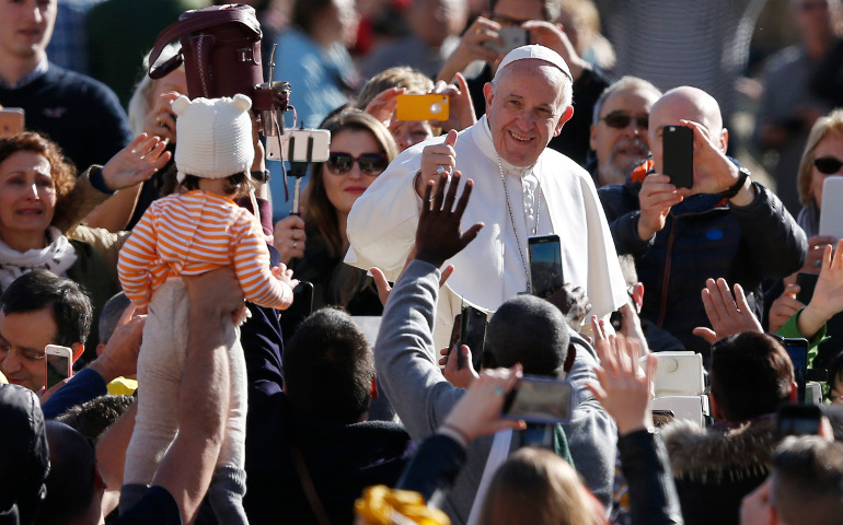 Pope Francis greets the crowd during his general audience in St. Peter's Square at the Vatican March 1. (CNS/Paul Haring)