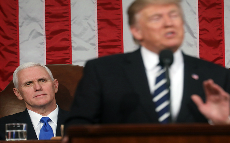 Vice President Mike Pence, left, listen as President Trump delivers his first address to a joint session of Congress from the floor of the House of Representatives in Washington, D.C., on Feb. 28, 2017. (Reuters/Jim Lo Scalzo/Pool)