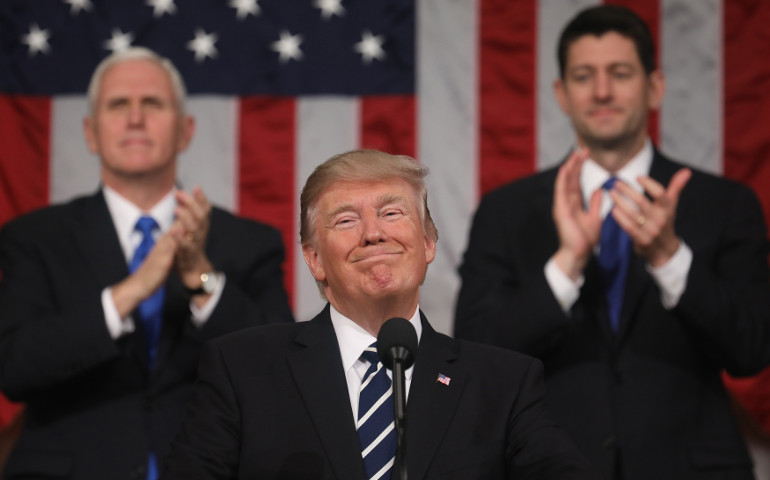President Donald Trump reacts to applause from members of Congress, Vice President Mike Pence and House Speaker Paul Ryan, R-Wis., while delivering his first address to a joint session of Congress Feb. 28 in Washington. (CNS/Jim Lo Scalzo pool via Reuters)