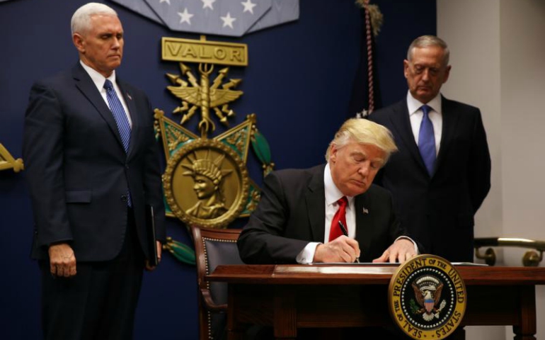 U.S. President Donald Trump signs a revised executive order for a U.S. travel ban March 6 at the Pentagon in Arlington, Virginia. (CNS/Carlos Barria, Reuters)