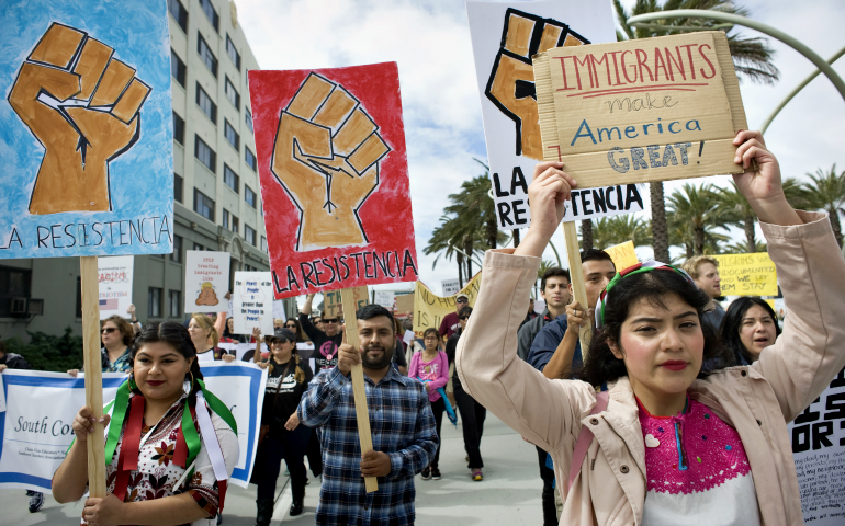 People in San Diego demonstrate in support of migrants and refugees Feb. 18. (CNS/EPA/David Maung)