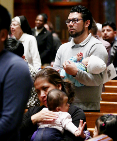 Jose Marroquin and his son Jose Jr., of Avondale, Penn., attend Liturgy of the Word for justice for immigrants and refugees March 19 at the Cathedral Basilica of Sts. Peter and Paul in Philadelphia. (CNS/CatholicPhilly/Sarah Webb)