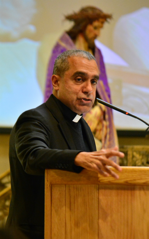Msgr. Anthony Figueiredo, regional coordinator of the Migrants and Refugees Section of the Vatican's Dicastery for Promoting Integral Human Development, speaks March 11 at SS. Cyril and Methodius Parish in Sterling Heights, Mich., during the annual Holy Trinity Apostolate Symposium. (CNS photo/Mike Stechschulte, The Michigan Catholic)