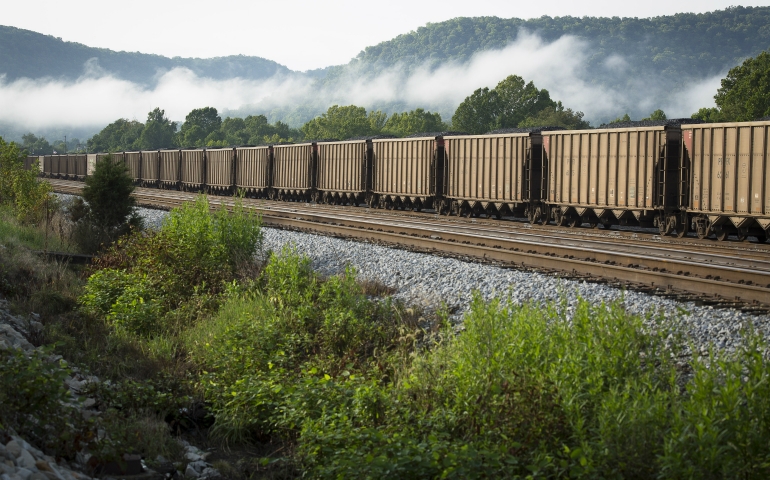 A train carries coal near Ravenna, Ky., in this 2014 file photo. Bishop Frank J. Dewane of Venice, Fla., chairman of the bishop's Committee on Domestic Justice and Human Development, said in a statement March 29 that President Donald Trump's executive order calling for a review of the Clean Power Plan jeopardizes environmental protections and moves the country away from a national carbon standard. (CNS photo/Tyler Orsburn)