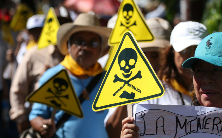 Protesters in San Salvador, El Salvador, demonstrate against mining exploitation March 9. El Salvador passed a law March 29 banning metal mining nationwide, making the small Central American country the first in the world to outlaw the industry.(CNS photo/Oscar Rivera, EPA)