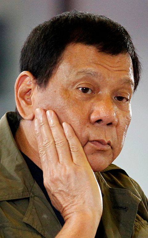Philippine President Rodrigo Duterte pauses during a March 11 news conference in Baguio City. The head of the Catholic Bishops' Conference of the Philippines assured the government that the country's church leaders are not against Duterte, just some of his policies. (CNS photo/Harley Palangchao, Reuters)
