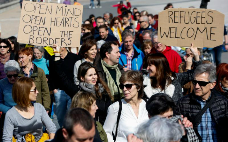 People take part in a Feb. 26 march to support refugees in San Sebastian, Spain. (CNS photo/Javier Etxezarreta, EPA)